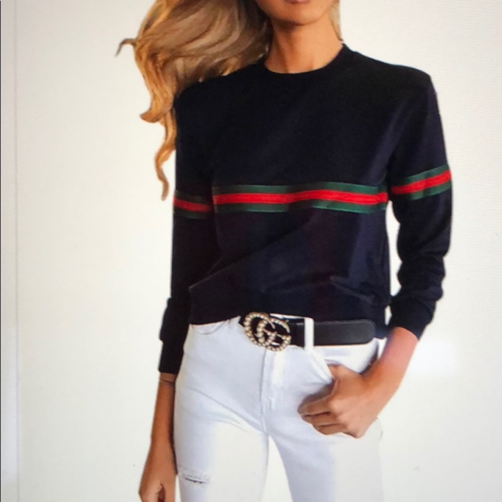 Black top with green and red stripes.